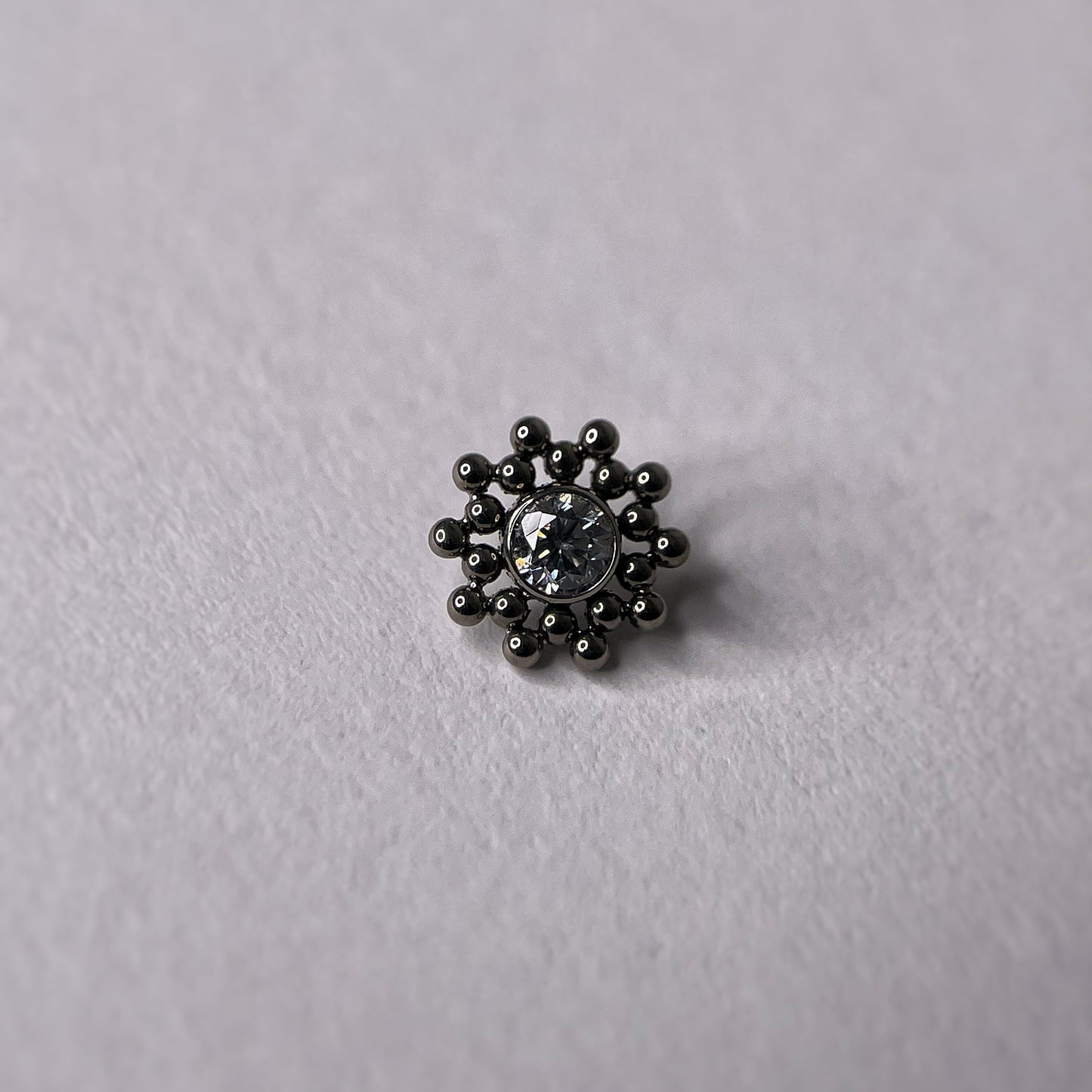 Sun con zircone