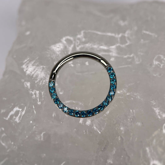 Anello Clicker in Titanio con zirconi CZ azzurri 1.2x10 mm
